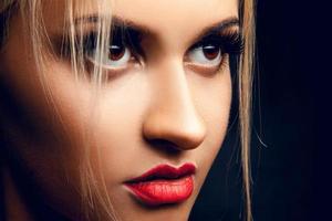 Close up portrait of gorgeous blonde girl looking away. Brown eyes. Professional make up photo