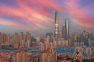 View of the skyline of Shanghai's Pudong business district against an impressive evening sky photo