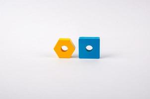 geometric shapes yellow and blue from toys on a light background photo