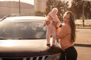 Cute young mother with her little baby girl photo