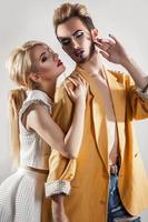 Stylish couple in love. Both with makeup. Vertical photo