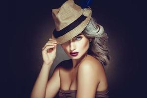 Horizontal photo of cute adult woman with beautiful makeup and grey hair color in stylish hat