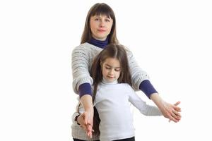 beautiful mom keeps little daughter hands photo