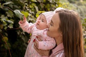 Cute young mother with her little baby girl photo