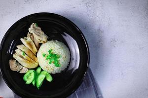 Hainanese chicken rice with soup or steamed chicken and sauces. photo
