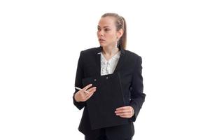 beautiful young blonde in a black business suit holding a Tablet photo