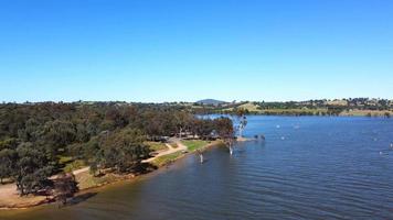 The aerial drone point of view footage at Bowna Waters Reserve is natural parkland on the foreshore of Lake Hume popular boat launching location in Albury, NSW ,Australia. video