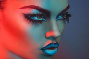 Portrait of sexy woman with healthy skin in red and blue lights photo