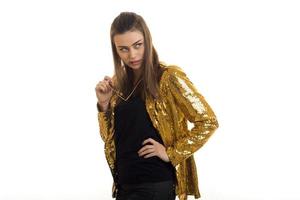 stylish young women in bright gold jacket photo