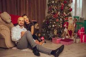 portrait of beautiful couple in love celebrate New year and xmas together at home photo