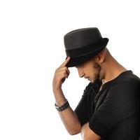 square profile portrait of serious unshaved man in hand and black shirt photo