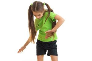 cute little girl in green shirt dancing in studio photo