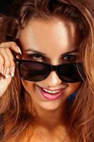 Happy girl in sunglasses photo