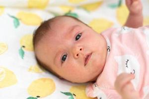 closeup portrait of a beautiful little baby girl photo