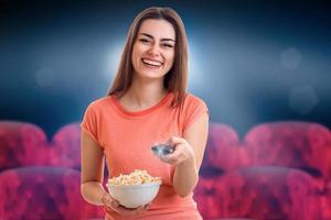 Cheerful brunette woman watching movie photo