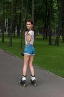 happy young girl rollerblading photo