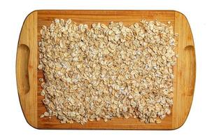 Rolled oat, oat flakes background or texture. Close up. Food concept. Healthy and wholesome food. photo