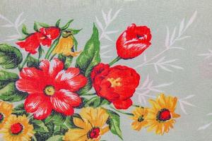 Composition of bright flowers on a coarse linen cotton fabric. Ukrainian ethnic ornament. photo