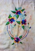 Towel with Ukrainian ethnic ornament, well embroidered with satin stitch, close-up photo