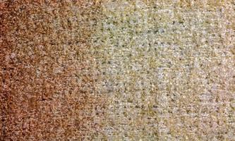 Knitted wool textile textured background in light beige creamy brown shade. Beige color gradient on texture background. photo