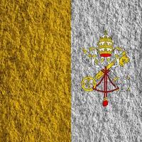 Flag of the Vatican City on a textured background. Concept collage. photo