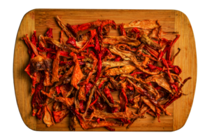 Background of dried organic red capsicum kappia sweet bell pepper chips, paprika and fresh pepper slices. The concept of healthy eating. png