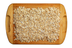 Rolled oat, oat flakes background or texture. Close up.  Food concept. Healthy and wholesome food. png