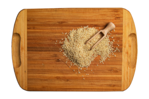 Sesame seeds on a wooden kitchen board. Healthy food concept. png