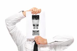 Shouting businessman with exclamation point photo