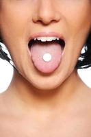 Woman Taking pills photo