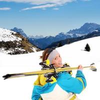 Woman with ski equipment photo