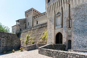 Torrechiara,Italy-July 31, 2022-View of Torrechiara castle in the province of Parma during a sunny day photo