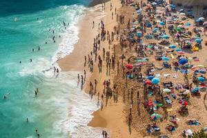 Algarve,Portugal-august 13, 2017-people on the beach in the Algarve coast in Portugal during a sunny day photo