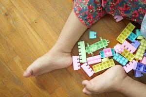 colorful building blocks on wooden table, close up photo