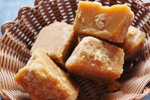 Jaggery traditional cane sugar cube on table photo