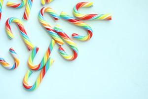 mini cherry candy canes on white background photo