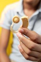 Hearing aid concept, teenage boy with hearing problems. photo