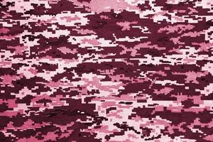 Fabric with texture of Ukrainian military pixeled camouflage. Cloth with camo pattern in grey, brown and green pixel shapes. Image toned in Viva Magenta, color of the year photo