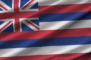 Hawaii US state flag with big folds waving close up under the studio light indoors. The official symbols and colors in banner photo