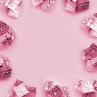 Piles of a small colored gift boxes with ribbons lies on a violet background Image toned in Viva Magenta, color of the 2023 year photo