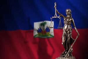 Haiti flag with statue of lady justice and judicial scales in dark room. Concept of judgement and punishment photo