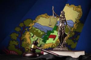 Vermont US state flag with statue of lady justice, constitution and judge hammer on black drapery. Concept of judgement and guilt photo