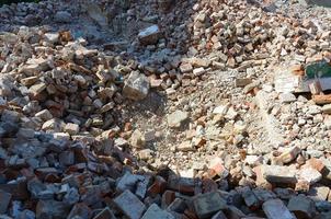 Pile of bricks and fragments of concrete from destroyed building photo