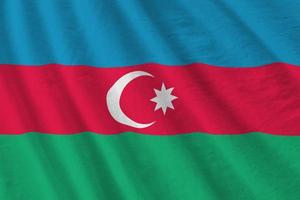 Azerbaijan flag with big folds waving close up under the studio light indoors. The official symbols and colors in banner photo