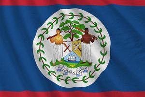 Belize flag with big folds waving close up under the studio light indoors. The official symbols and colors in banner photo