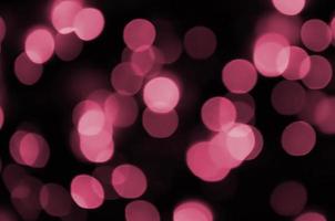 Abstract background image with bokeh effect. Image toned in Viva Magenta, color of the 2023 year photo