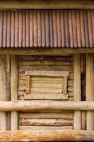 Log cabin barn unpainted debarked wall textured horizontal background photo