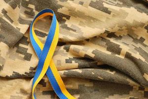 Pixeled digital military camouflage fabric with ribbon photo