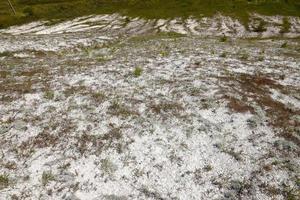 Ancient multimillion chalk mountains on the steppe surface of earth photo