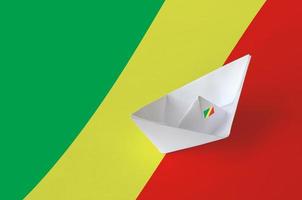 Congo flag depicted on paper origami ship closeup. Handmade arts concept photo